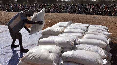 A worker lays out bags of grain at the Doro refugee camp about 26 miles from the border in South Sudan's Upper Nile state.