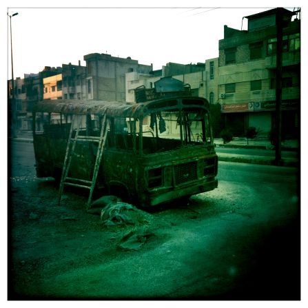 A wrecked bus lies abandoned in Baba Amr in Homs.