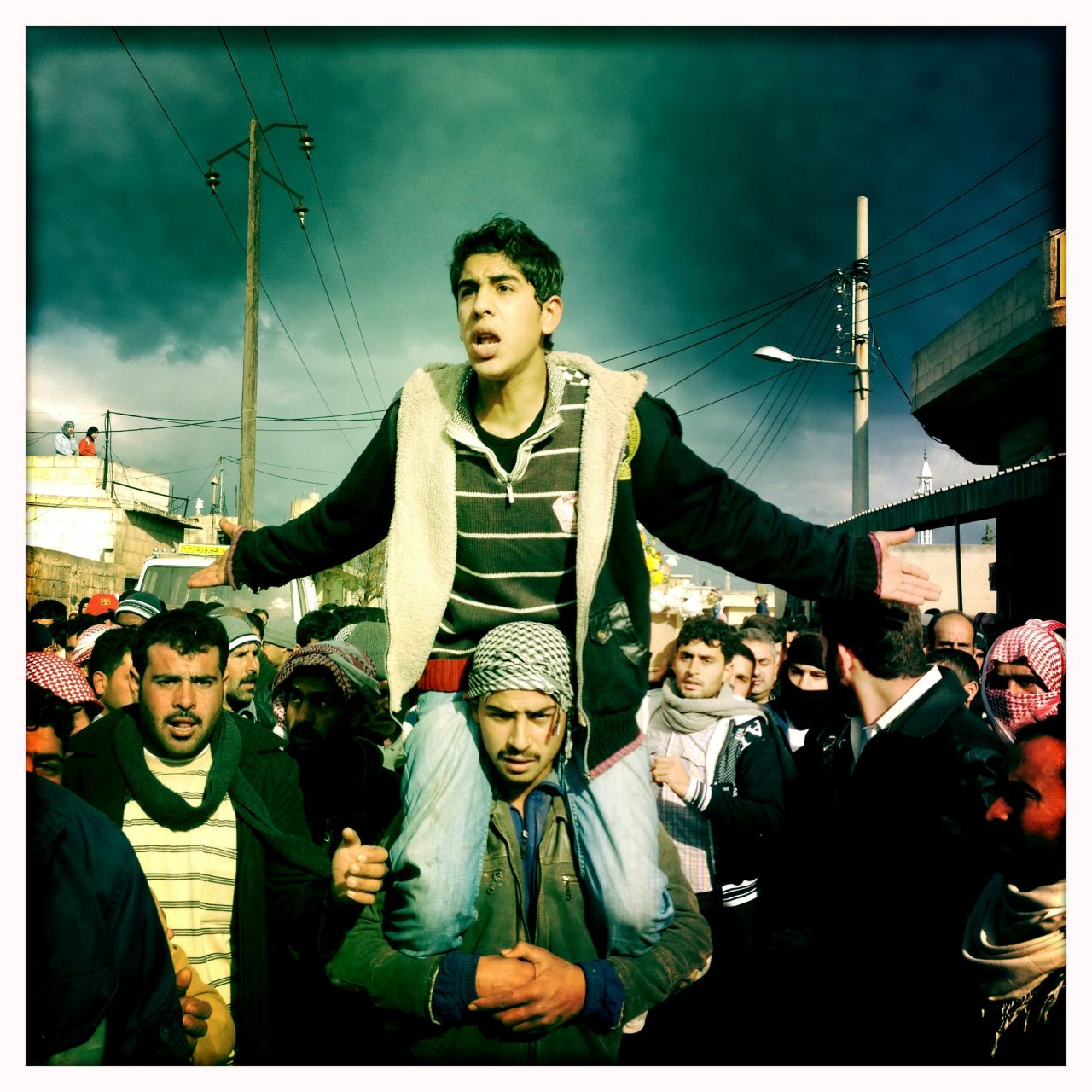 Mourners are pictured at the funeral procession for "Malik" in Dar al-Kabira.