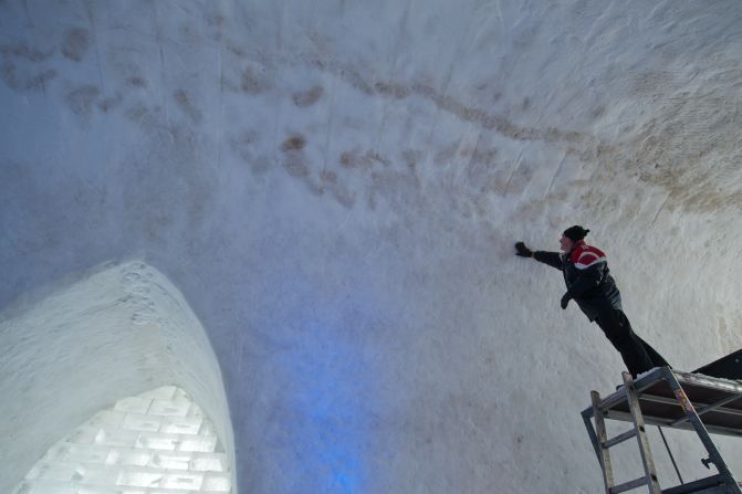 A man works on the snow church in Mitterfirmiansreut.