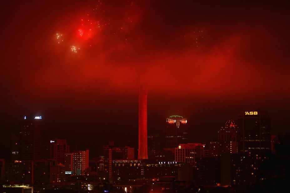 New Zealand was among the first countries to ring in the new year, but the fireworks display at the top of Auckland's Sky Tower was obscured by low clouds.