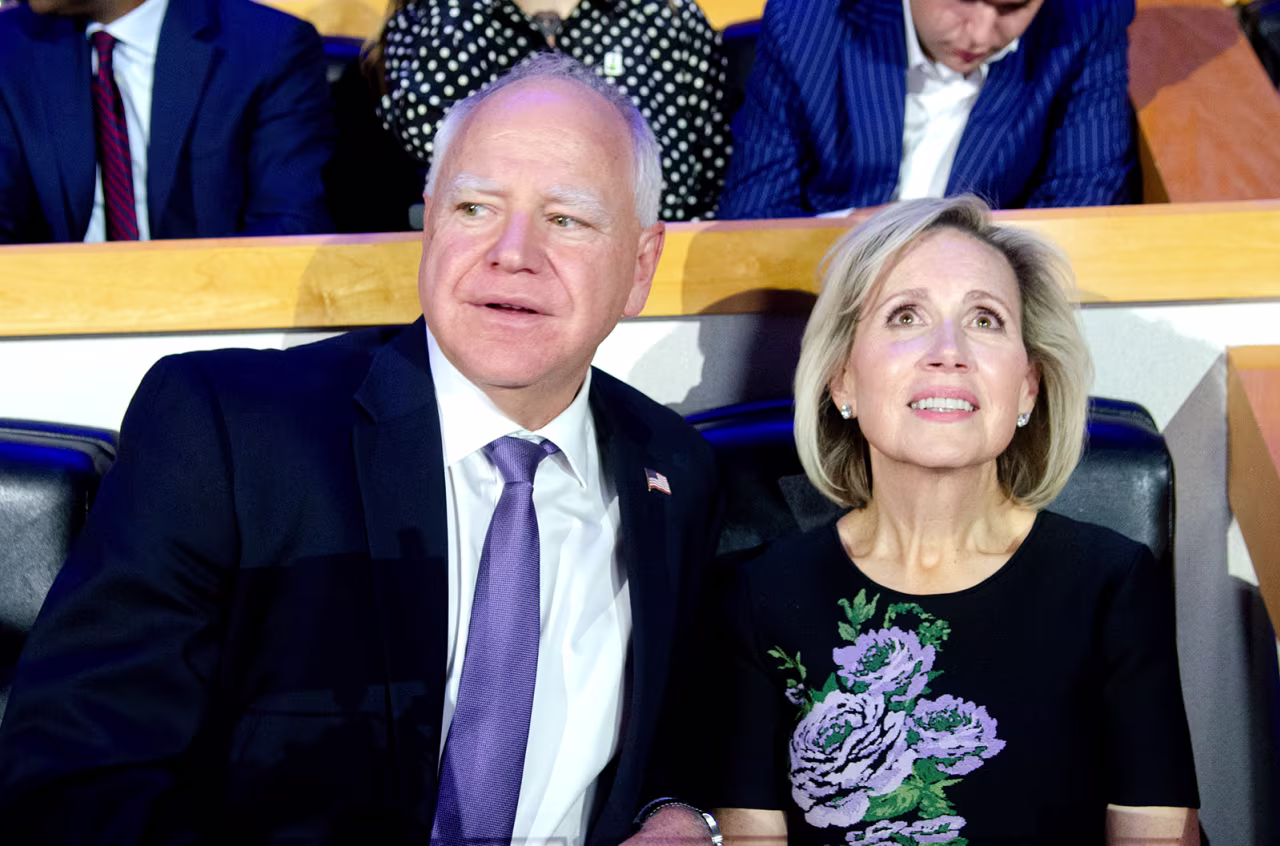 Democratic vice presidential candidate Minnesota Gov. Tim Walz (L) and his wife Gwen Walz attend the first day of the Democratic National Convention.