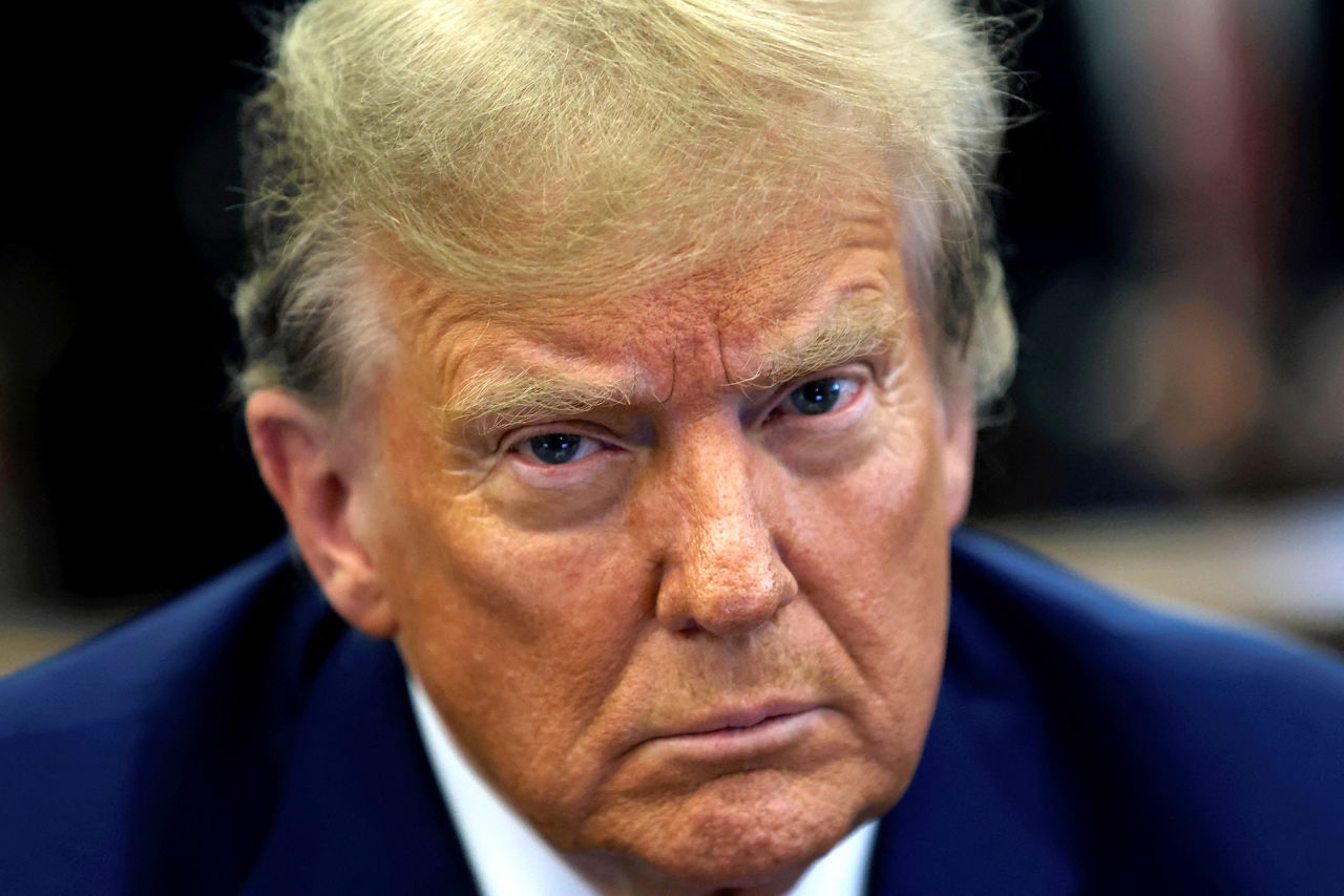 Former US President Donald Trump sits in New York State Supreme Court during the civil fraud trial against the Trump Organization, in New York City on January 11.