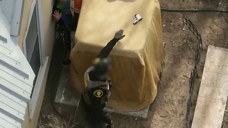 Drone video shows officers disarm two young boys with loaded handgun