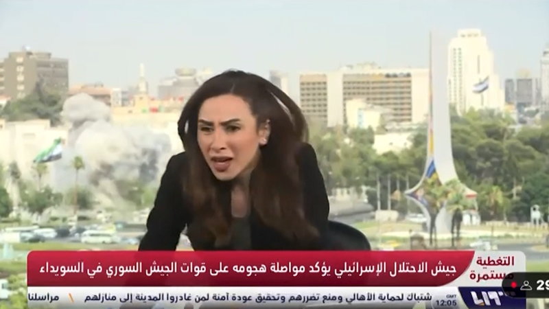 Syrian anchor takes cover from airstrike live on TV