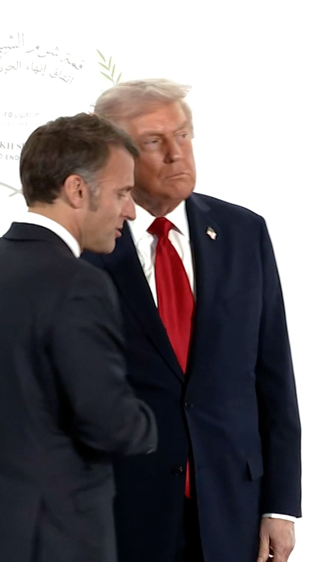 114522_Macron Trump Handshake VERT THUMB CL.jpg