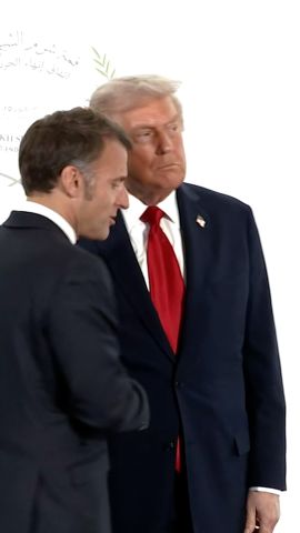 114522_Macron Trump Handshake VERT THUMB CL.jpg