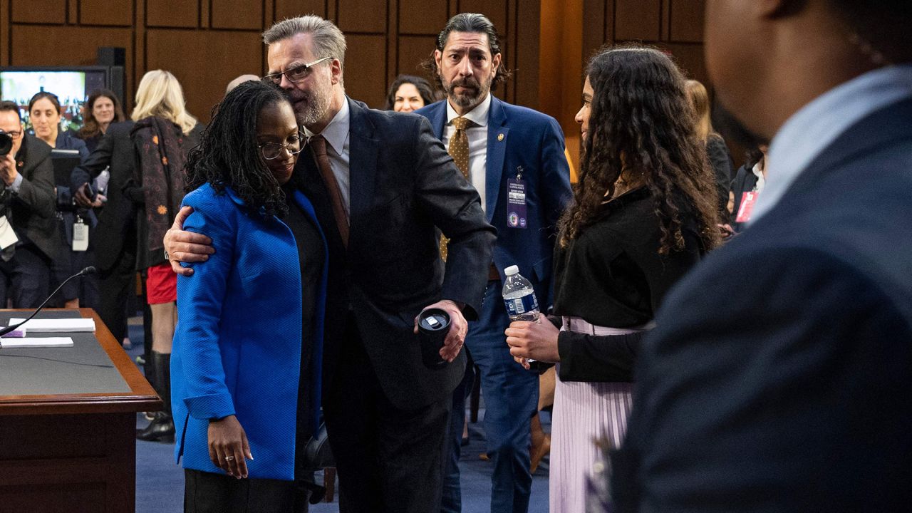 Judge Ketanji Brown Jackson gets a hug from her husband Dr. Peter Jackson at the conclusion of the Senate Judiciary Committee confirmation hearing on March 23.