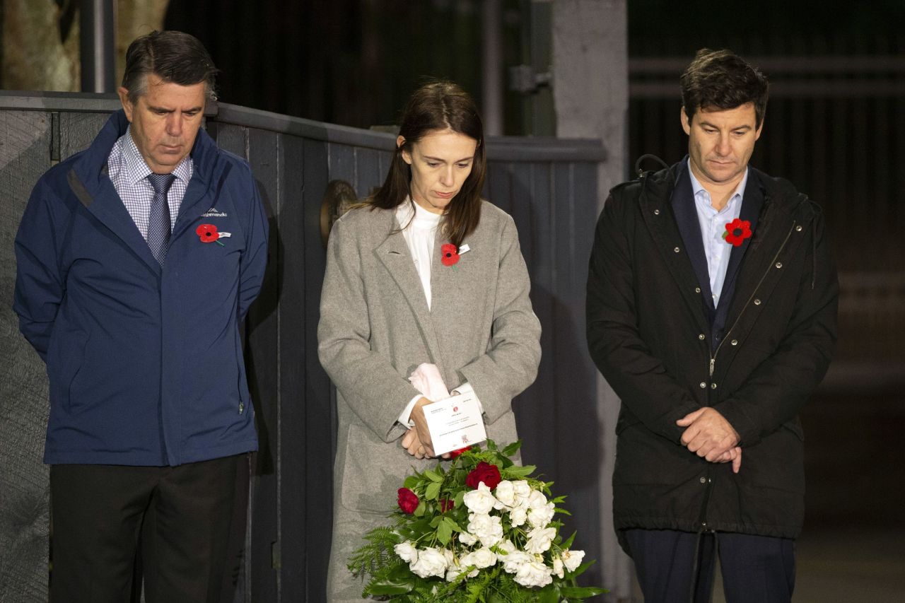 New Zealand Prime Minister Jacinda Ardern, center, with her father Ross Ardern, left, and partner Clarke Gayford stand outside Premier House in Wellington to mark Anzac Day on April 25.