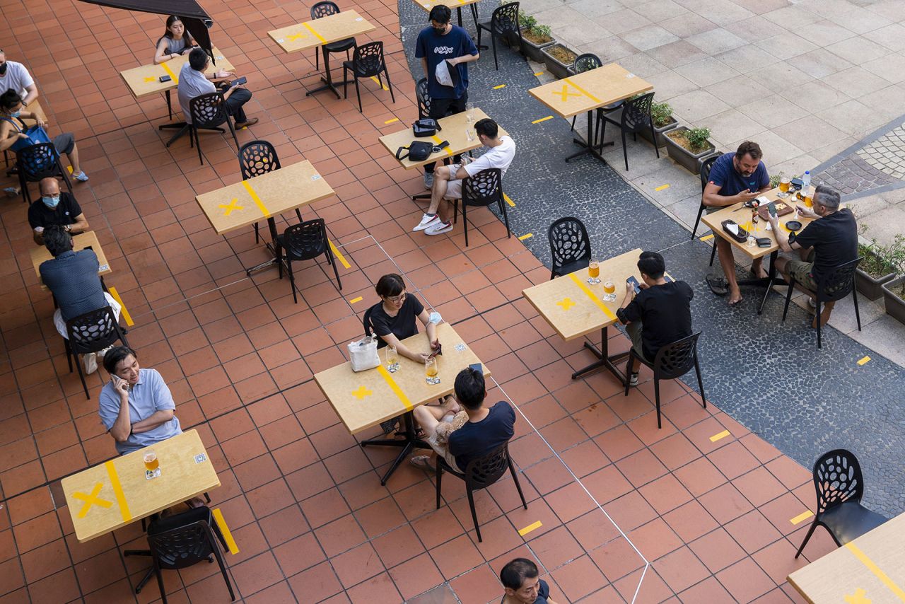 Diners eat at a restaurant in Singapore on June 21.