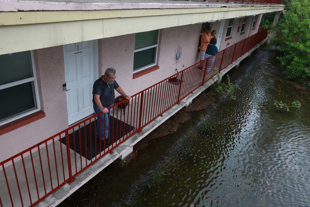 Ken Kruse looks out at the flood waters from Hurricane Idalia surrounding his apartment complex  in Tarpon Springs, Florida, on August 30, 2023.