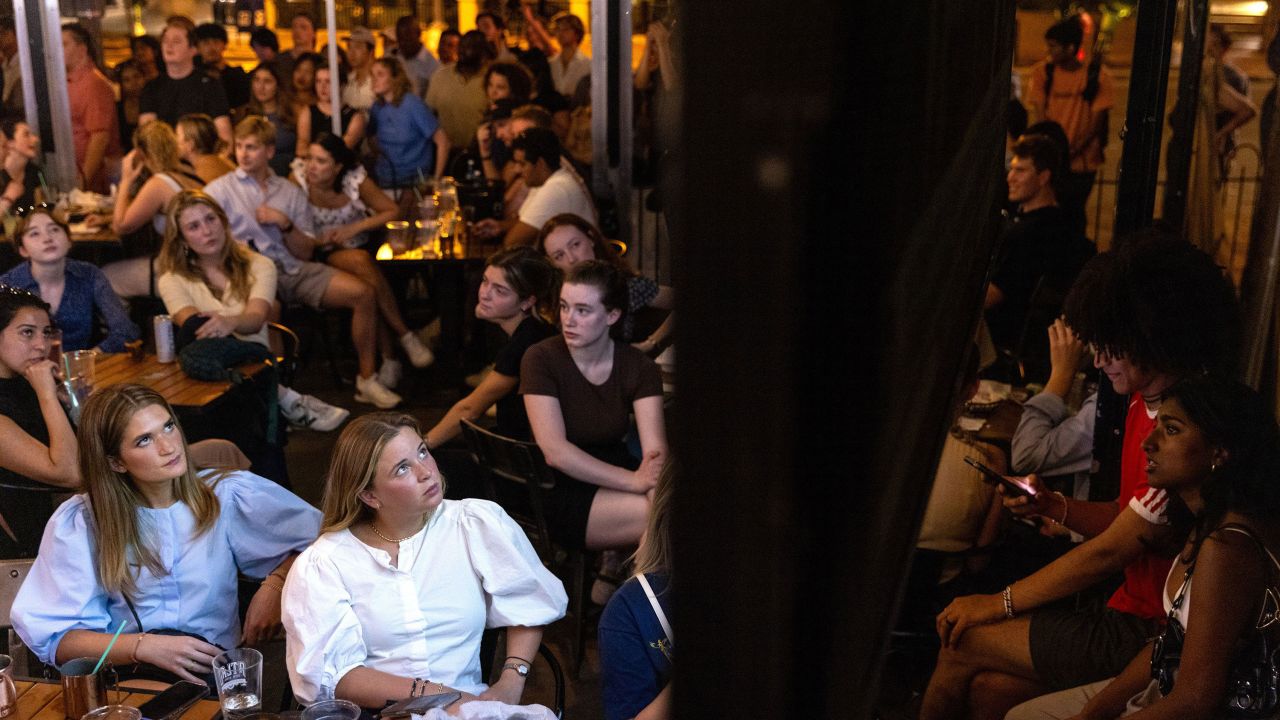 People watch the CNN presidential debate during a watch party at Union Pub in Washington, DC, on June 27. 