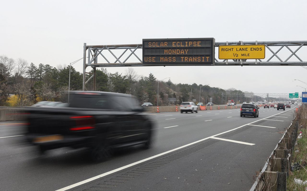 A digital sign along the Long Island Expressway advises drivers of the solar eclipse, in Medford, New York on April 2, 2024.