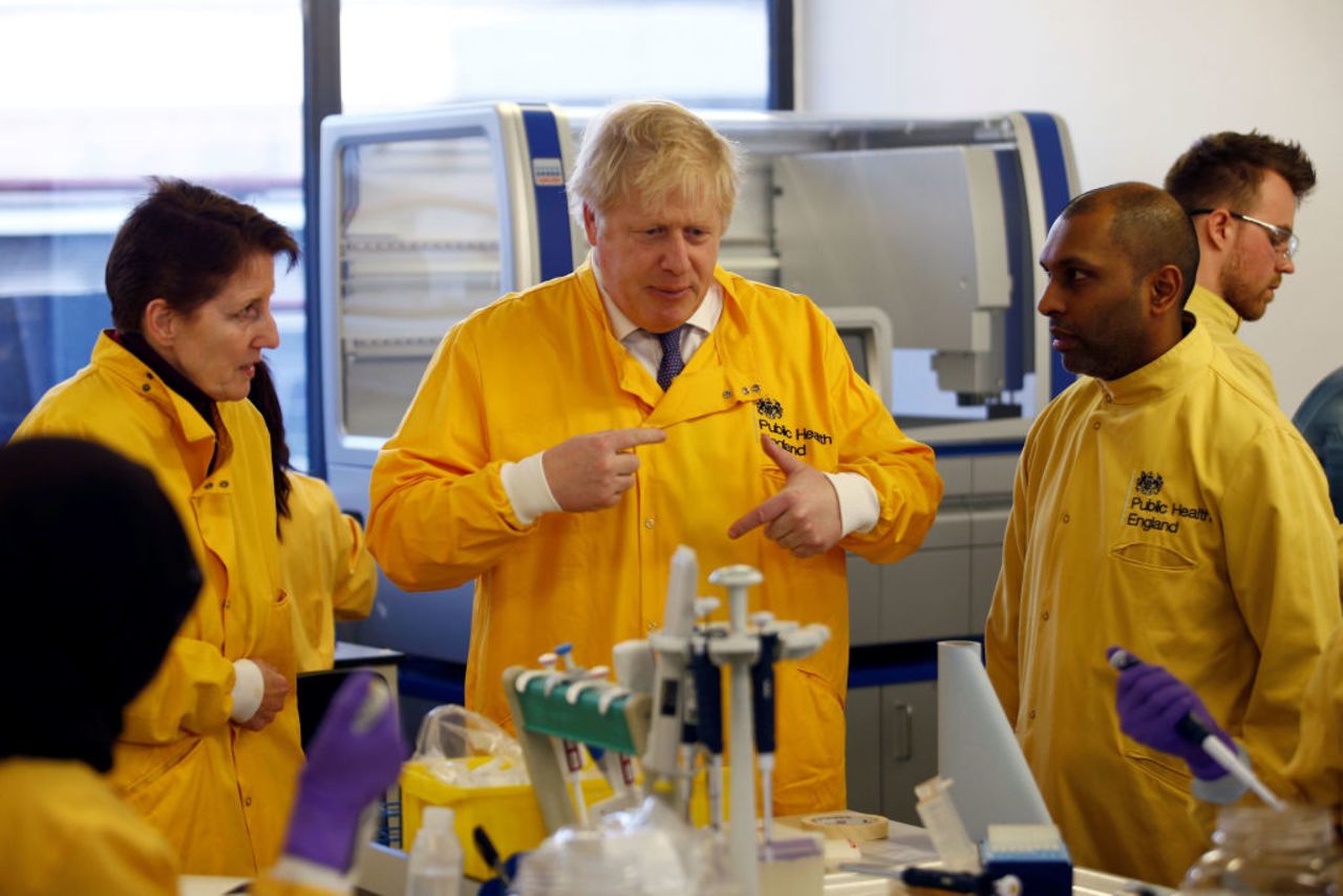 British Prime Minister Boris Johnson visits a laboratory at the Public Health England National Infection Service in Colindale, London yesterday.