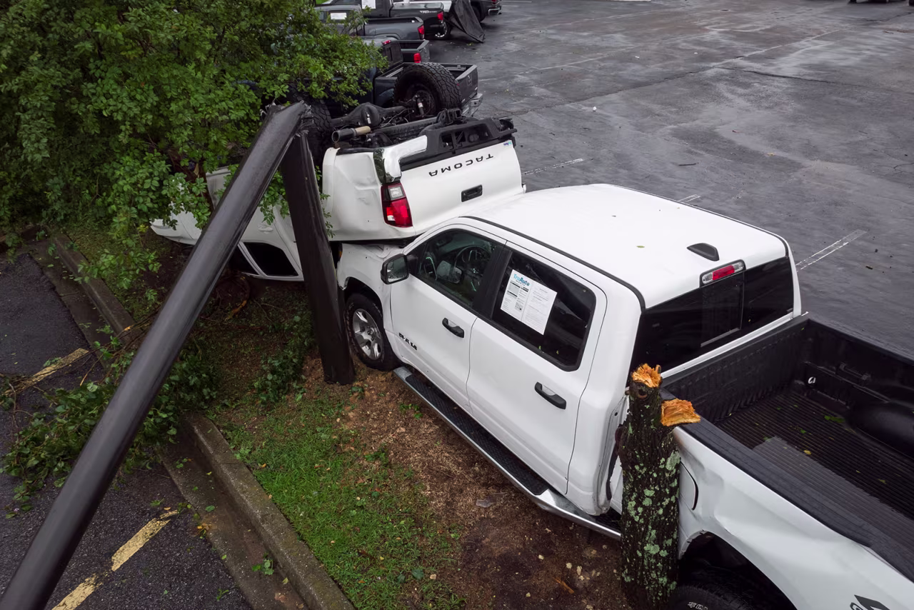 Damaged trucks are seen at a car dealer in Moncks Corner, South Carolina, on August 7, after a tornado hit the area.