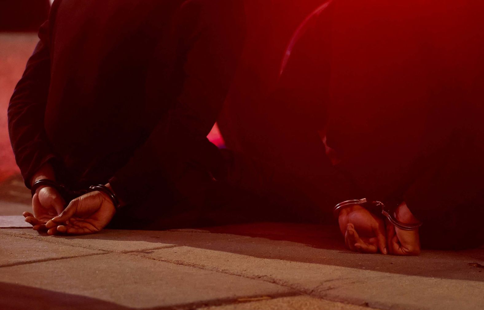 Two handcuffed people sit on a sidewalk in Washington, DC, while being detained by law enforcement on Tuesday, September 9. Last month, President Donald Trump announced that he was placing the Washington, DC, police department <a href="index.php?page=&url=https%3A%2F%2Fwww.cnn.com%2Fpolitics%2Flive-news%2Ftrump-presidency-dc-crime-08-11-25">“under direct federal control”</a> and deploying National Guard troops to the nation’s capital.