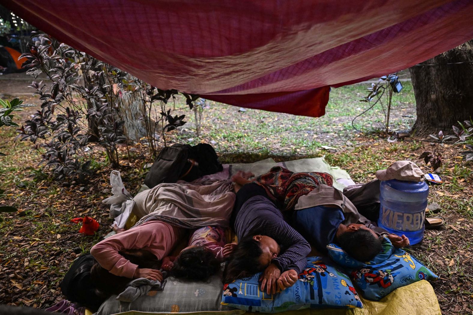People sleep outside in Mati City, Philippines, on Saturday, October 11, after <a href="index.php?page=&url=https%3A%2F%2Fwww.cnn.com%2F2025%2F10%2F09%2Fasia%2Fphilippines-earthquake-mindanao-intl-hnk">two powerful offshore earthquakes</a> on Friday. Towns near the epicenter suffered structural damage.