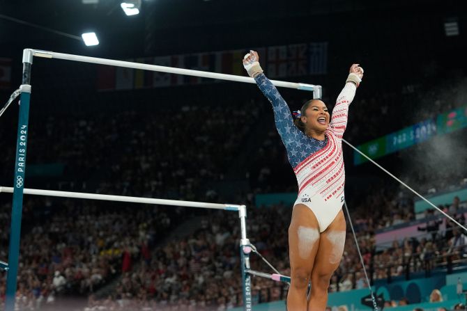 Chiles celebrates after her uneven bars routine. <a href="https://www.cnn.com/sport/live-news/paris-olympics-news-2024-07-30#h_33a1a30c948c329e2fd1d7ce63cb2cda">Her score of 14.366</a> put the United States in solid position.