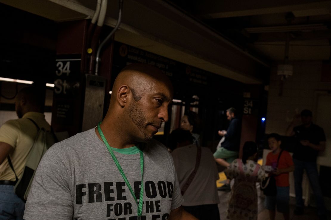 Henry Thomas distributes food in the New York City subway.