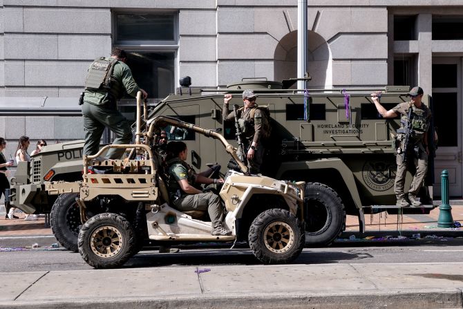 Police and military personnel are seen around the French Quarter on the day before the game.