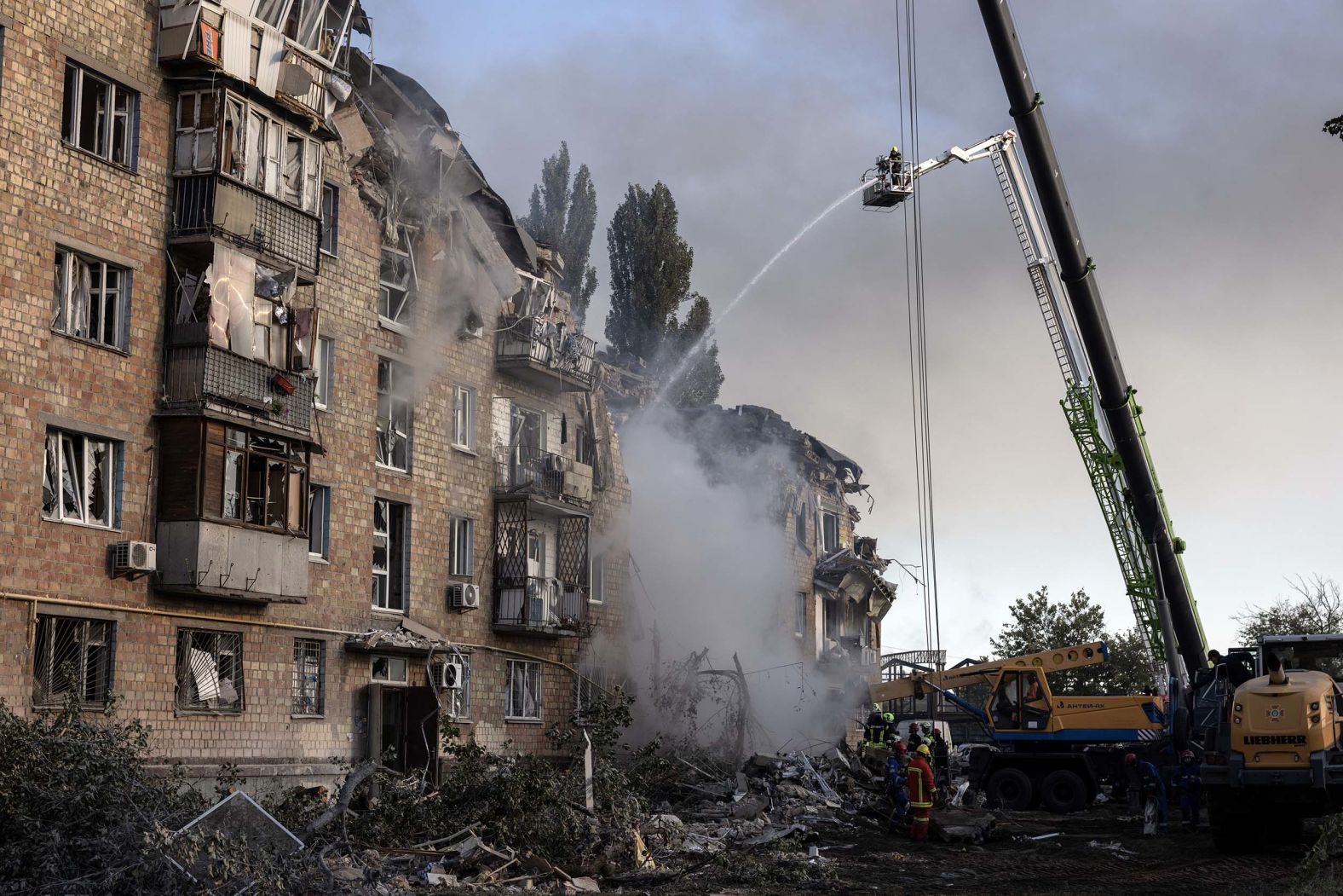 Firefighters and first responders work at an apartment building in Kyiv, Ukraine, after an <a href="index.php?page=&url=https%3A%2F%2Fwww.cnn.com%2F2025%2F08%2F28%2Feurope%2Fukraine-russia-kyiv-attack-hnk-intl">hourslong barrage of Russian missiles and drones</a> on Thursday, August 28. It was Russia’s second-biggest aerial attack since its full-scale invasion of Ukraine in February 2022.