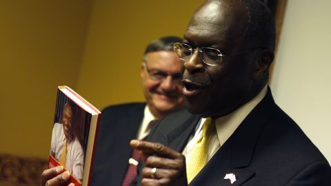 Herman Cain jokes about his book at a campaign appearance in Arizona in October.