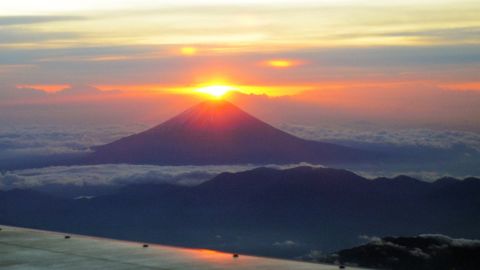 The sun rises on New Year's Day behind from Mt. Fuji in Japan's Yamanashi prefecture on January 1. 
