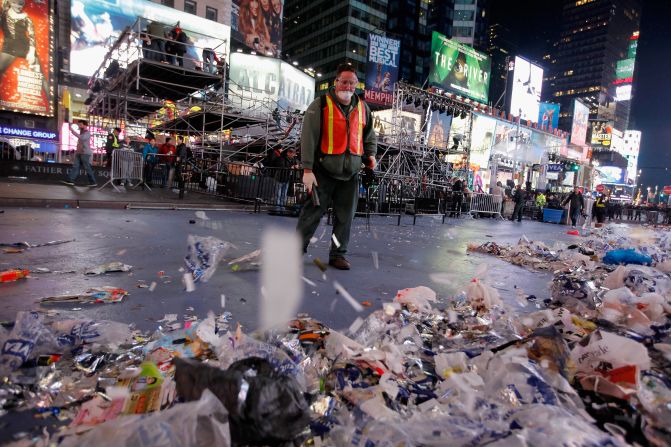 Workers clean up after thousands of revelers gathered in New York's Times Square to celebrate the ball drop at the annual New Year's Eve celebration.
