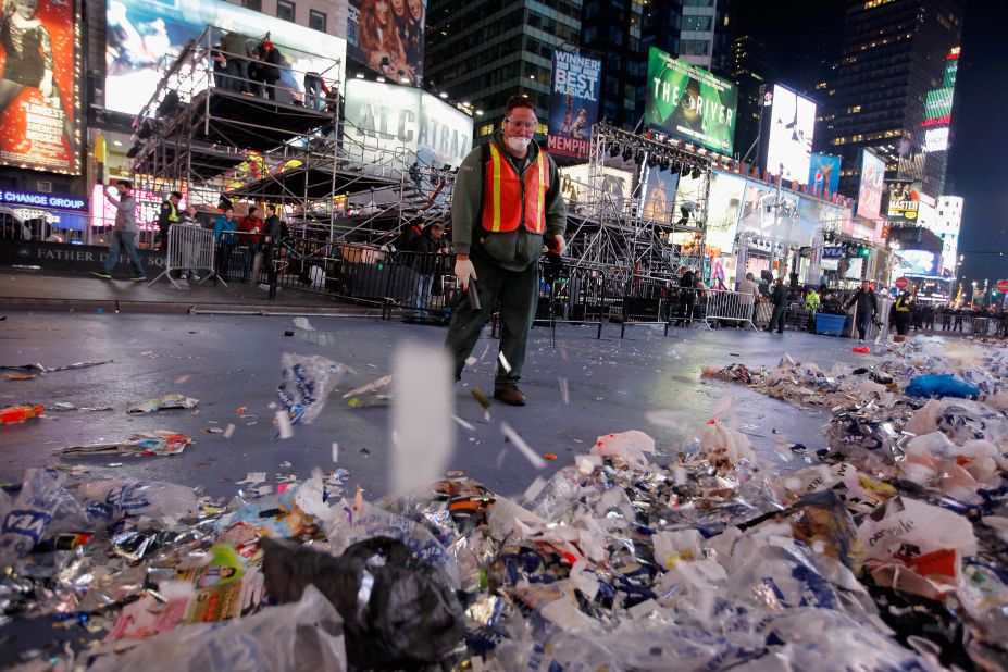 Workers clean up after thousands of revelers gathered in New York's Times Square to celebrate the ball drop at the annual New Year's Eve celebration.