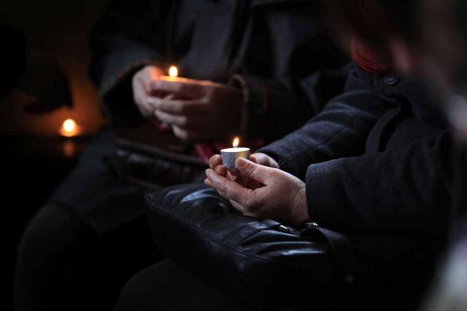 Candles are lit ahead of the 10th New Year's Eve peace vigil being held inside the 700-year-old St. Giles Church in the village of Imber in Salisbury Plain, England. The church, along with the rest of the village, was evacuated in December 1943 by the military for training U.S. soldiers preparing for the D-Day invasion, and villagers were told at the time they would be allowed to return in six months. But despite public appeals, the village remains in the control of the Ministry of Defense. 