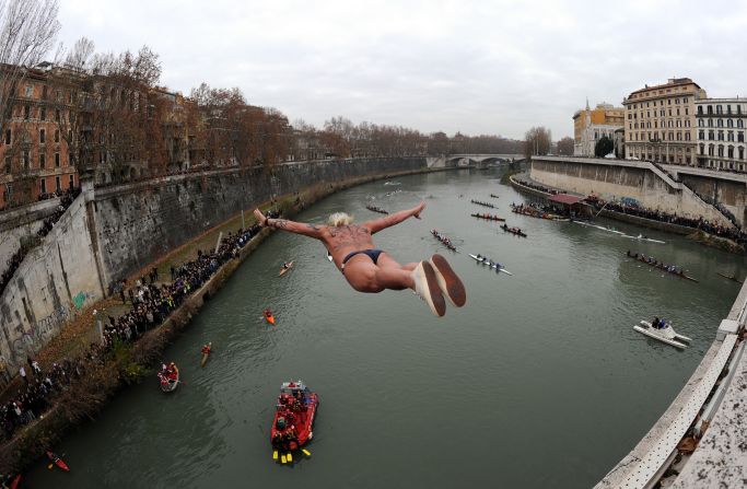 A reveler in Italy takes a celebratory dive into Rome's Tiber River as part of traditional New Year's celebrations on Sunday, January 1, 2012. 