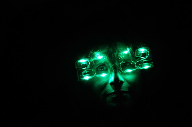 A concert-goer in  Las Vegas lights up 2012. 