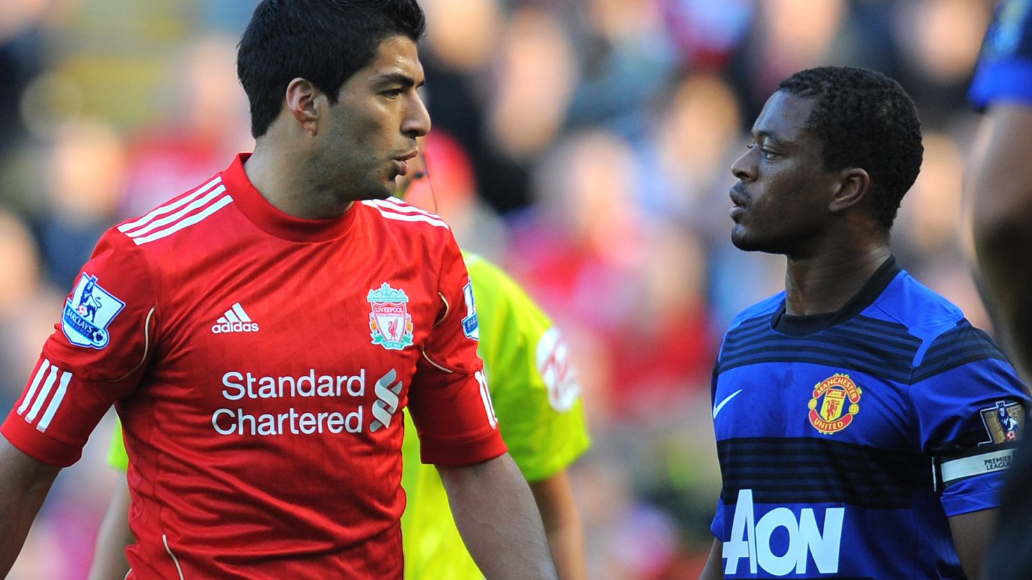 Luis Suarez and Patrice Evra are involved in a heated exchange during the October 15 match at Anfield.