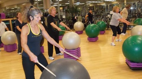 Instructor Janet Anderson leads a drumming class at Total Woman Gym and Day Spa in Placentia, California. 