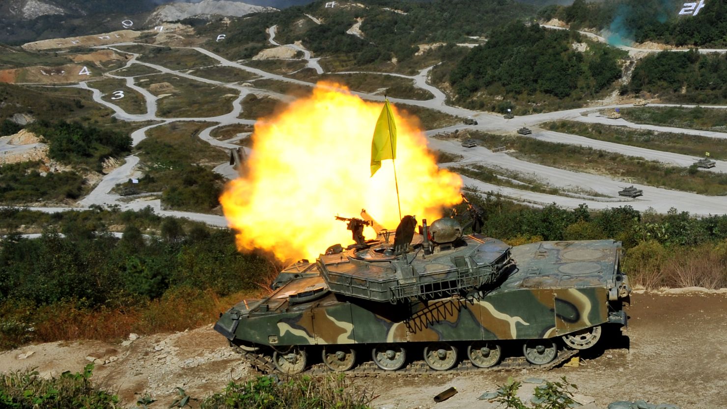 A South Korean K-1 tank fires live rounds during a military exercise near the border with North Korea on September 30, 2011. 