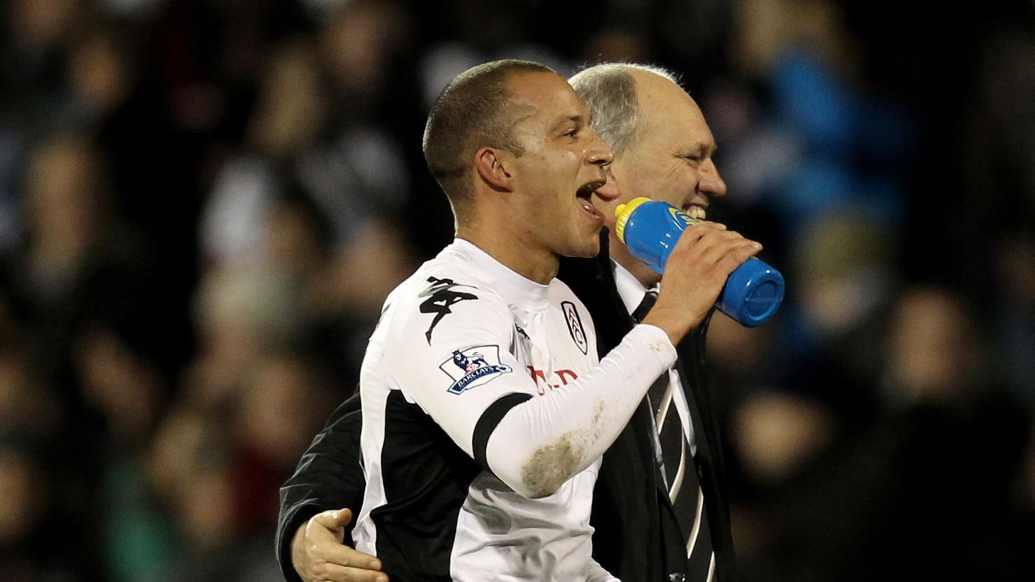 Manager Martin Jol celebrates with goalscorer Bobby Zamora after Fulham's late 2-1 win over Arsenal.