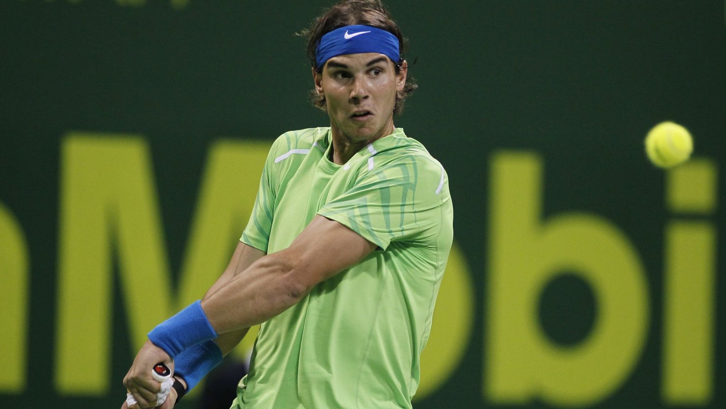 Rafael Nadal plays a return during his first round win over Philipp Kohlschreiber in Qatar