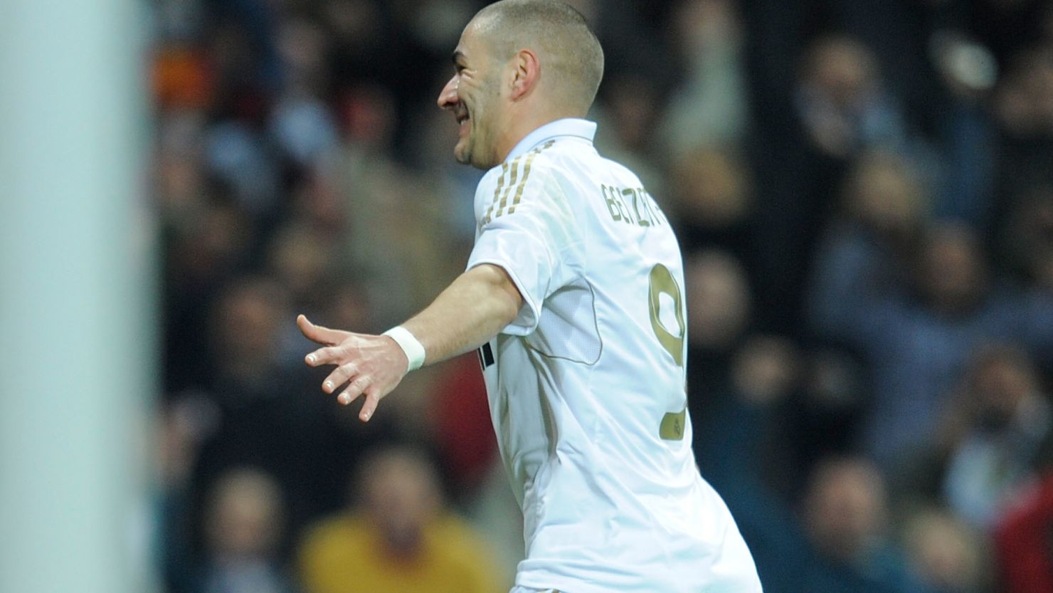 Karim Benzema wheels away after scoring Real Madrid's winner in the Bernabeu.
