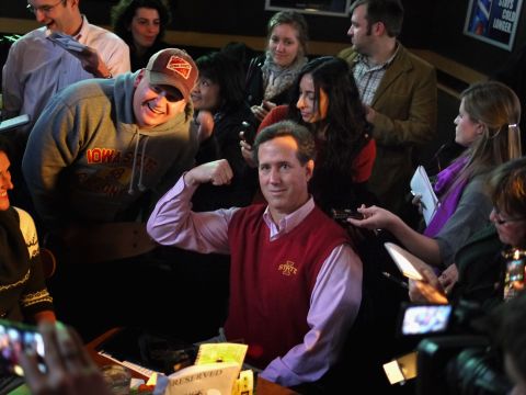 We'll say this for the sweater vest -- it sure shows off Santorum's guns. And solid red is a always an appropriate choice for a GOP candidate. Here Santorum poses for a picture while hosting a Pinstripe Bowl- watching party at a restaurant in Ames, Iowa. Go Cyclones!