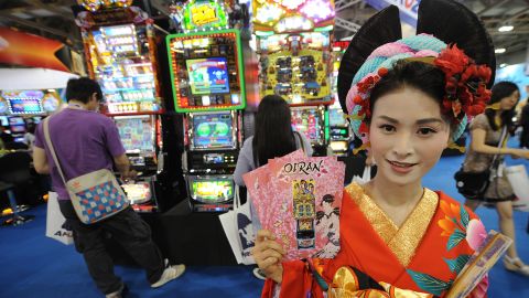 A model poses for pictures at a gaming exhibition in Macau on June 8, 2011. 