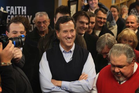 Santorum looks relaxed here in a navy blue sweater vest, layered nicely over a light-blue dress shirt. We're sure supporters at the Daily Grind coffee shop in Sioux City, Iowa, picked up on the subtle presidental tones. 