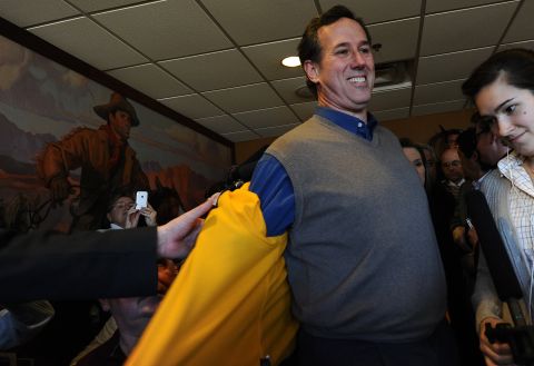 Republican presidential hopeful Rick Santorum rips off his jacket to reveal the hottest trend in candidate wear. Nothing quite says lunch at the Pizza Ranch restaurant in Boone, Iowa, like a sweater vest, right? This was not the first time Santorum sported such a fashion-forward ensemble. Check out his other campaign-trail couture choices leading up to Tuesday's Iowa caucus. 