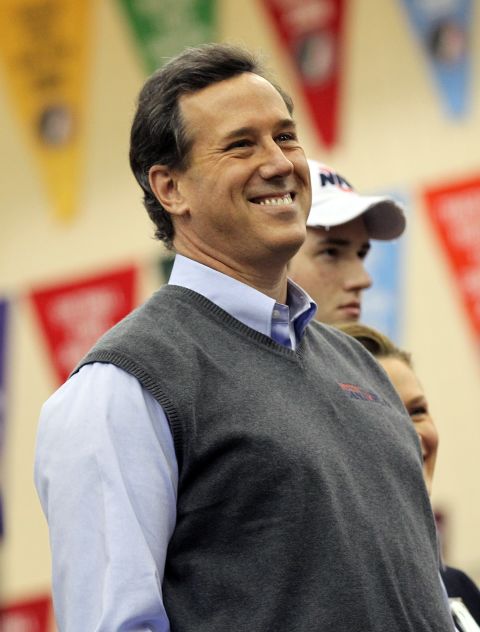 A light-grey sweater vest conveys solid seriousness, but it may look a little staid for Santorum's "Rock the Caucus" event in West Des Moines. Senator, where was the leather vest?