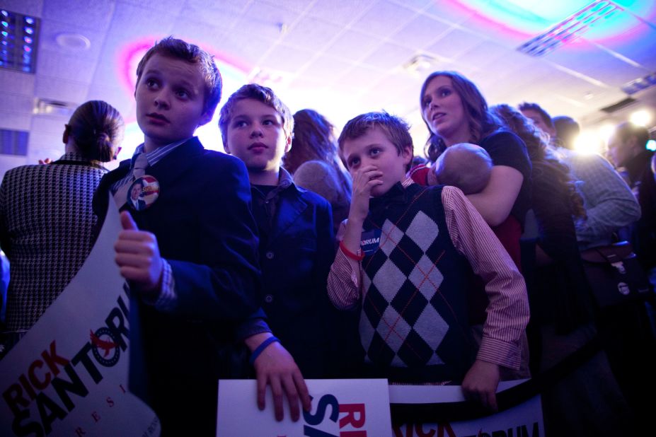 Oh, and what's this -- is the younger generation jumping aboard the sweater vest train? A member of the Duggar family supports Santorum's style on caucus day in Johnston, Iowa. 