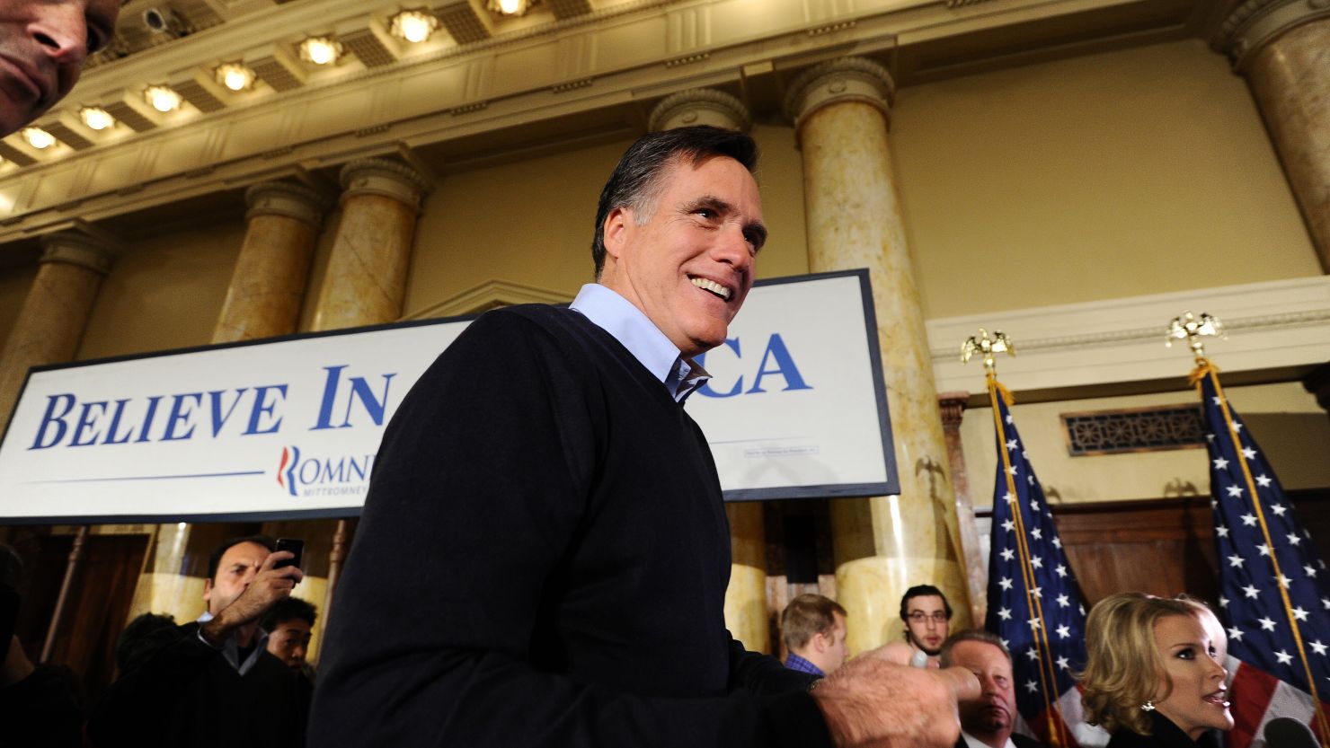 Republican presidential hopeful Mitt Romney greets supporters during a campaign rally Tuesday in Des Moines, Iowa.