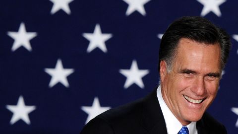 Mitt Romney appears at a rally Tuesday night in Des Moines, Iowa.