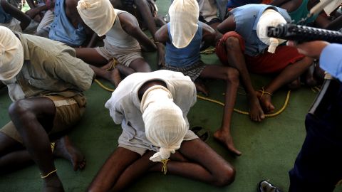 Suspected pirates sit with their faces covered on an Indian coast guard ship in this file pic dated February 10, 2011.