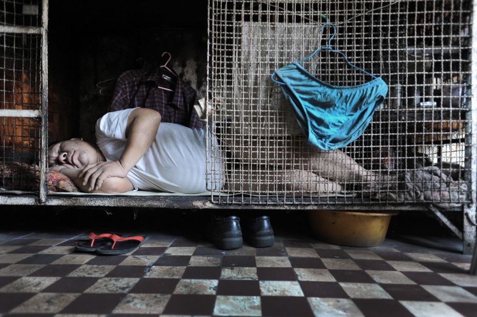 ... as these images taken earlier this year of people in Hong Kong living in nothing more than cages attest to.