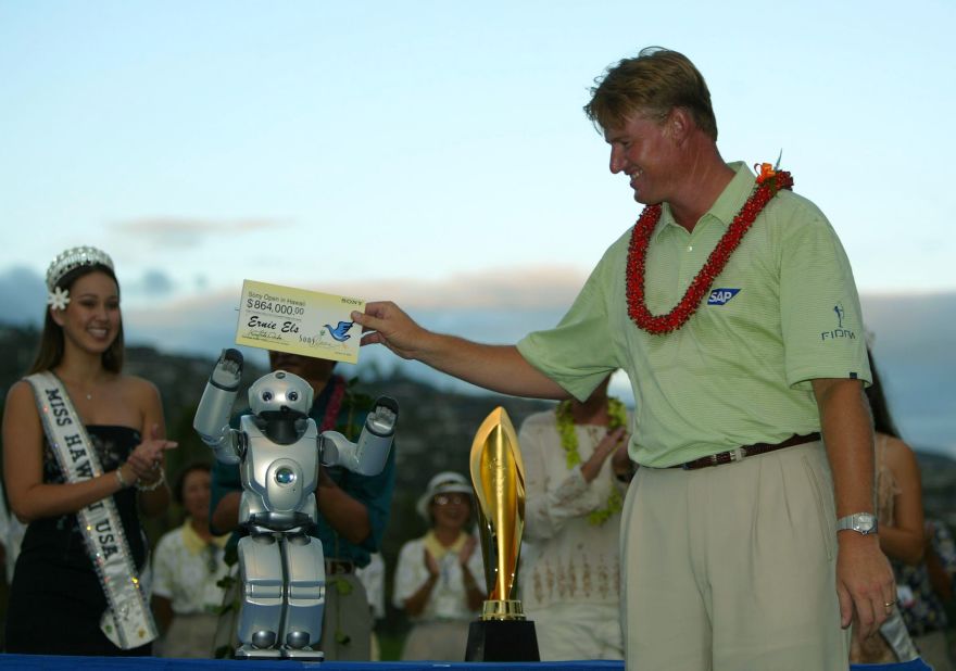 South African star Ernie Els receives his winning check from Qrio at the 2004 Sony Open.