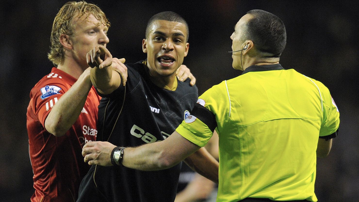 Oldham's Tom Adeyemi reacts after hearing a supporter shouting towards him during Friday's FA Cup tie at Liverpool.